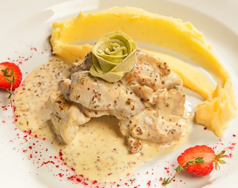 Rabbit in a creamy mustard sauce with mashed potatoes